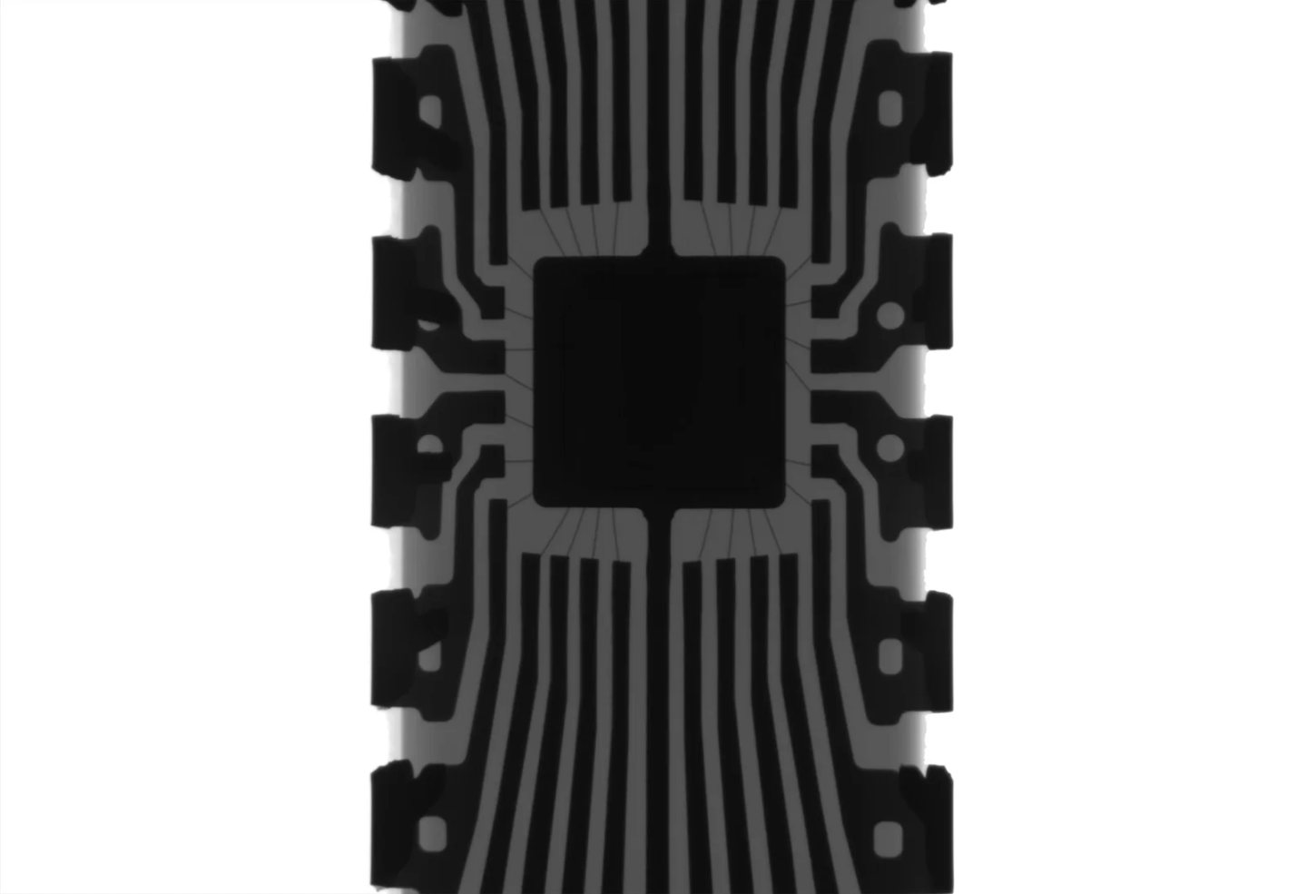 Radiographie en noir et blanc d'une puce Arduino