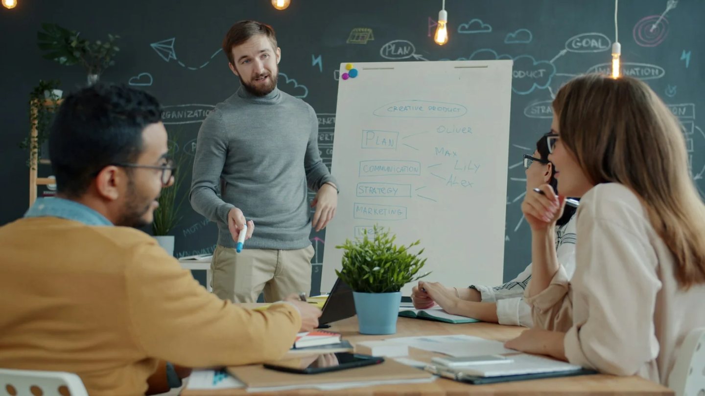 Team working together at a whiteboard